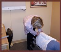 Dr. Christensen Adjusts a Patient