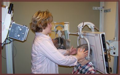 Dr. Christensen Prepares A Patient for X-Raying